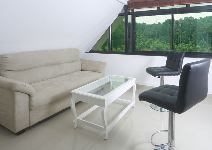 Sitting area with sofa and bar stools